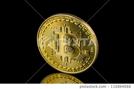 Bitcoin on dark background, Close up golden bitcoin a digital currency, operates on a decentralized system with transactions recorded and new units created without central authority 118864088