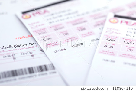 Close-up of an electricity bill from the Electricity Authority of Thailand. The image highlights energy costs and household budgeting in a typical Thai context 118864119