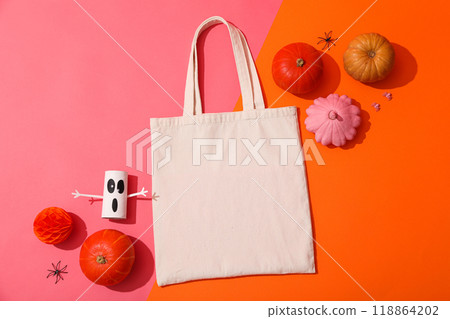 A white bag with pumpkins and a decorative ghost A white bag with pumpkins and a decorative ghost 118864202