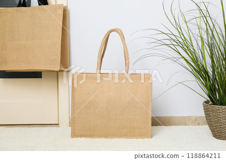 The bag hangs on the doorknob in the room 118864211