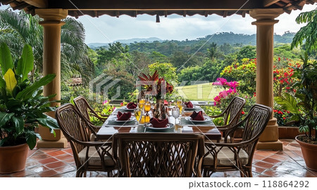 Outdoor dining table with lush greenery view 118864292