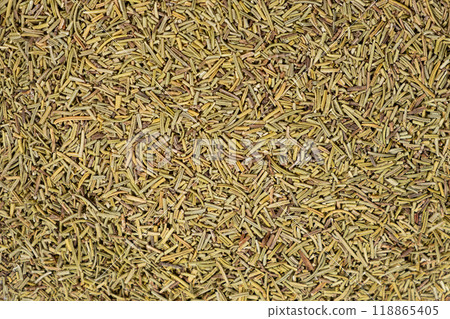 Background crushed dried rosemary leaves top view, seasoning texture. 118865405