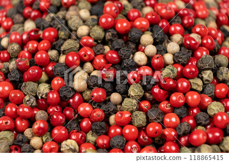 A mixture of different peppercorns white, black, red and green peppers spices. 118865415