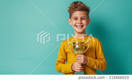 Joyful boy holding a golden cup. First place award. 118866029