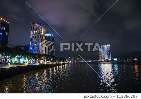 Da Nang city with a Han River Bridge over the Han river and skyscrapers hotels in Vietnam at night Da Nang city with a Han River Bridge over the Han river and skyscrapers hotels in Vietnam at night 118866287