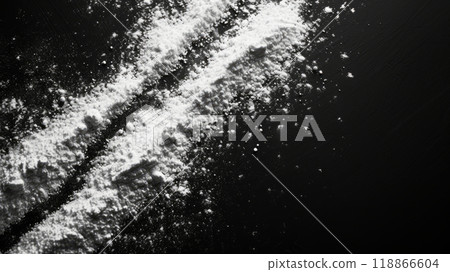 White powder scattered on a black background 118866604