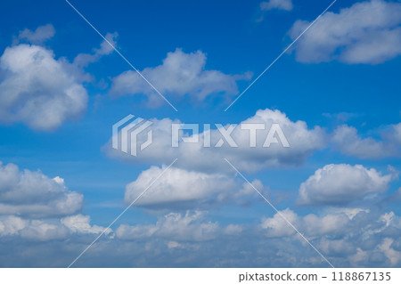 Beautiful blue sky with white clouds forming on sunny day 118867135