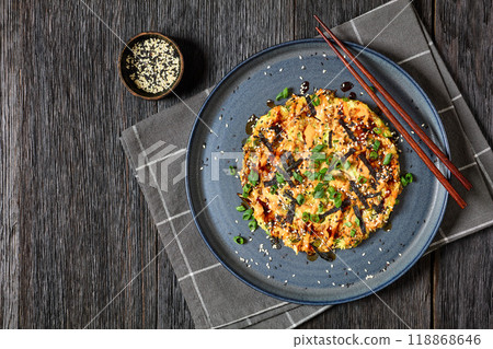 Japanese pancake with cabbage on a plate, top view 118868646