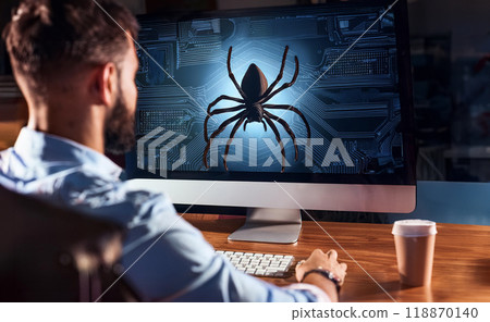 Computer on desk, spying on information, hacker 118870140