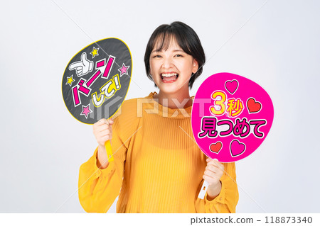 A woman holding a fan A woman holding a fan 118873340