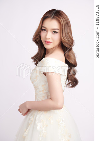 Beautiful young asian woman in wedding dress on white background, Beautiful young asian woman in wedding dress on white background, 118873519