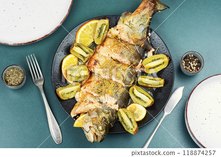 Whole baked trout fish. 118874257