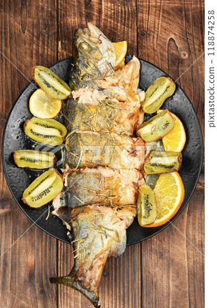 Whole baked trout fish. 118874258