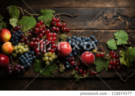 still life with bunches of grapes, berries and fresh and juicy fruits against a dark old wooden background, rural vintage style, the concept of fresh and healthy food 118874377