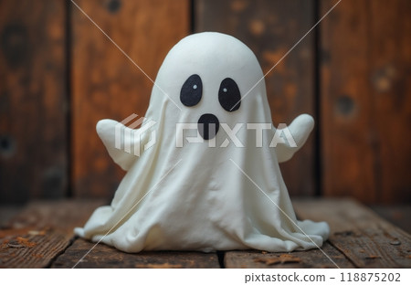 portrait of a cute little ghost in autumn decoration, Halloween holiday theme 118875202