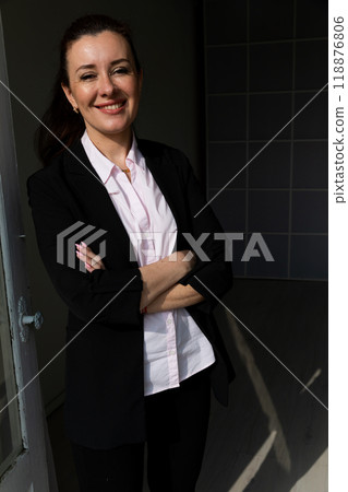 Brunette woman in a business black suit smile Brunette woman in a business black suit smile 118876806