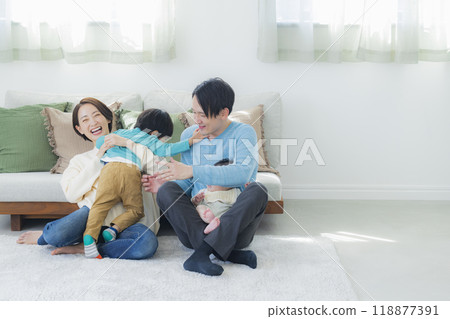 A family relaxing in the living room A family relaxing in the living room 118877391