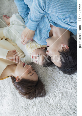 A family relaxing in the living room 118877666