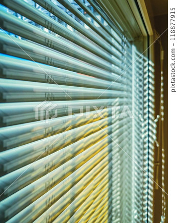Closeup view of window with closed horizontal blinds 118877915