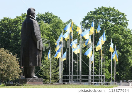 Statue of Andrejs Upitis with Ukrainian flags in Kronvalda park near the house of congress in Riga, Latvia 118877954