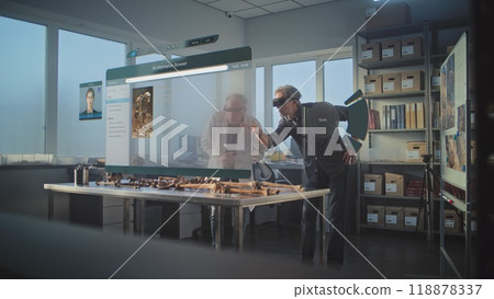 Archaeologists in VR headsets study skeleton using holographic display with AI assistant and browser Archaeologists in VR headsets study skeleton using holographic display with AI assistant and browser 118878337