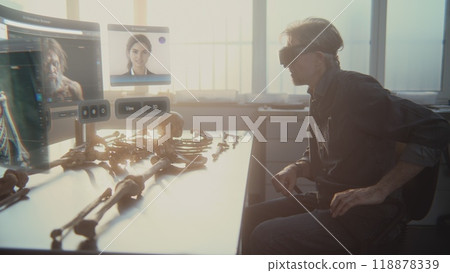 Archaeologist in VR headset studies ancient skeleton using augmented reality Archaeologist in VR headset studies ancient skeleton using augmented reality 118878339