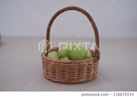 A water guava resting in a tiny basket A water guava resting in a tiny basket 118878554
