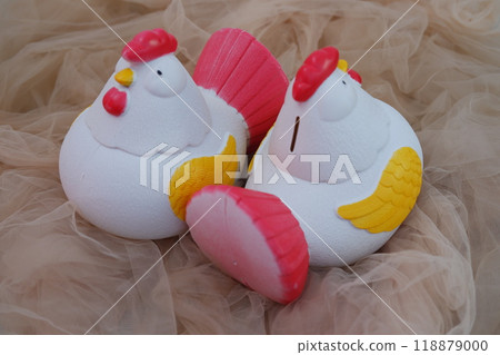 Chicken shaped ornament in white and red colors Chicken shaped ornament in white and red colors 118879000