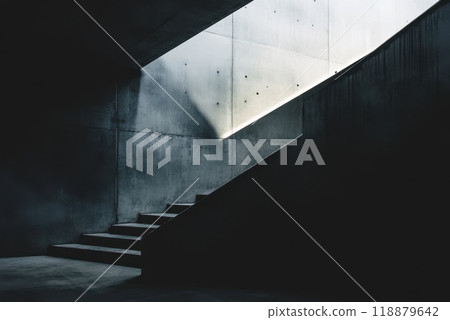 A view of a minimalist concrete stairwell illuminated by natural light during the day in a modern architectural space 118879642