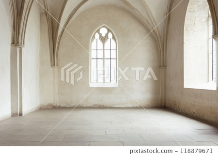 Empty historic room with gothic arches and large windows in an old building during daylight 118879671
