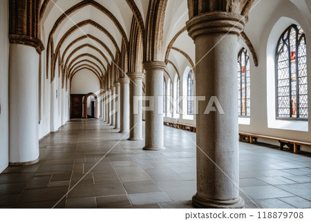 Exploring the serene corridor of a historic building with beautiful arches and architectural details in daylight Exploring the serene corridor of a historic building with beautiful arches and architectural details in daylight 118879708
