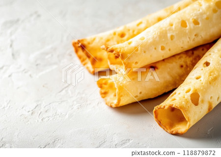 Homemade tortillas stacked neatly on a light textured surface ready for delicious meals and snacking 118879872