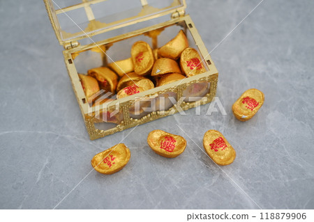 Box filled with gold coins on gray surface, symbolizing wealth and prosperity Box filled with gold coins on gray surface, symbolizing wealth and prosperity 118879906