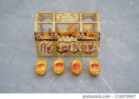 Box filled with gold coins on gray surface, symbolizing wealth and prosperity Box filled with gold coins on gray surface, symbolizing wealth and prosperity 118879907