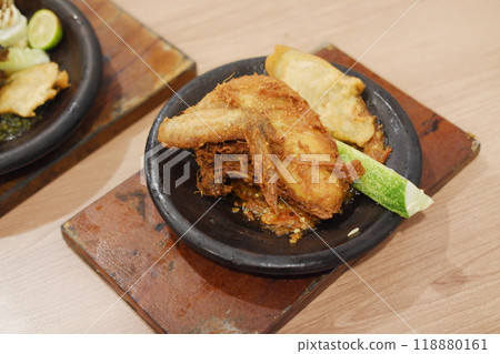 Indonesian food. It's fried chicken that cooked with special spice Indonesian food. It's fried chicken that cooked with special spice 118880161