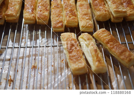 Homemade puff pastry on the stove in the kitchen. Selective focus. Homemade puff pastry on the stove in the kitchen. Selective focus. 118880168