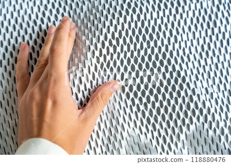 Hand on texture of corrugated white paper for safe transportation, in which the goods brought by the courier delivery service are wrapped, environmental packaging concept 118880476