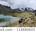 Traditional woman and horses at lake on a trail near Ausangate mountain, Cusco 118880605