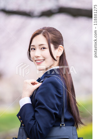 A high school girl commuting to school during the new semester 118881275