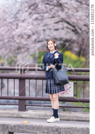 A high school girl commuting to school during the new semester 118881276
