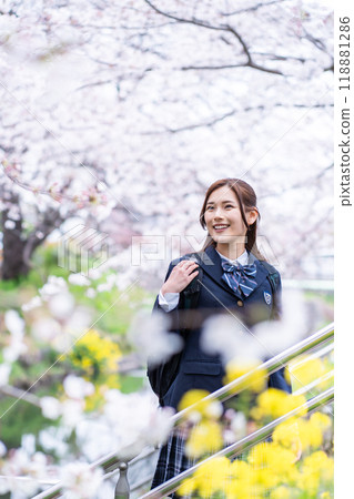 A high school girl commuting to school during the new semester 118881286