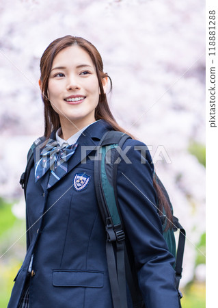 A high school girl commuting to school during the new semester 118881288