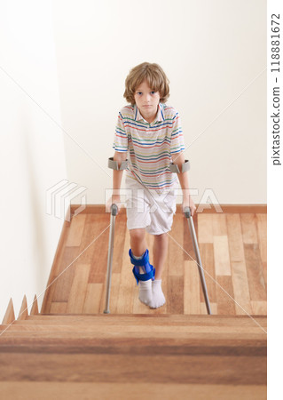 Injured child on crutches. Boy in cast on foot Injured child on crutches. Boy in cast on foot 118881672