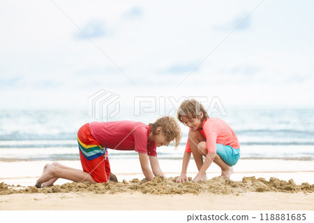 Kids playing on beach. Children play at sea. 118881685