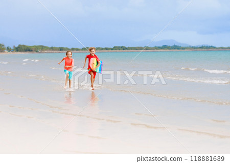 Kids playing on beach. Children play at sea. Kids playing on beach. Children play at sea. 118881689