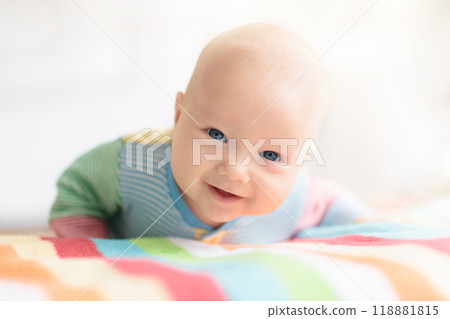 Little baby on white bed 118881815