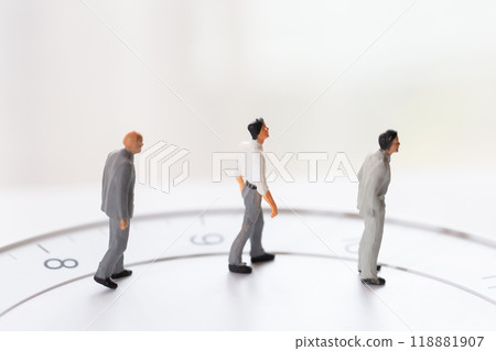 Clock face and male doll in business suit - image of working hours and career Clock face and male doll in business suit - image of working hours and career 118881907