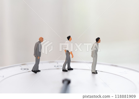 Clock face and male doll in business suit - image of working hours and career Clock face and male doll in business suit - image of working hours and career 118881909