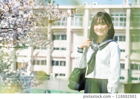 Portrait of a high school student with cherry blossoms and school 118882081