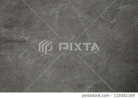 Crumpled dark grey paper background texture Crumpled dark grey paper background texture 118882169